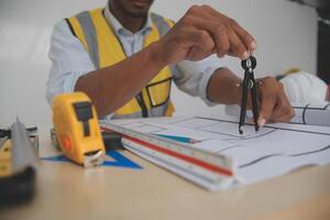Image of engineer meeting for architectural project. working with partner and engineering tools on workplace vintage tone. photo