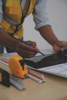 Image of engineer meeting for architectural project. working with partner and engineering tools on workplace vintage tone. photo