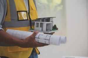 Image of engineer meeting for architectural project. working with partner and engineering tools on workplace vintage tone. photo