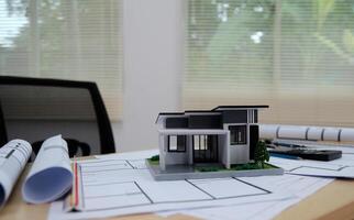 Architects, engineers, contractors working in the office with blueprints, inspection engineers Work analysis for architectural plan, construction project sketch, focus, business construction concept. photo