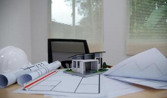 Architects, engineers, contractors working in the office with blueprints, inspection engineers Work analysis for architectural plan, construction project sketch, focus, business construction concept. photo