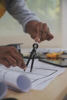 Image of engineer meeting for architectural project. working with partner and engineering tools on workplace vintage tone. photo