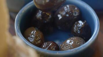 A Selection of Assorted Olives Displayed in a Charming Blue Bowl video