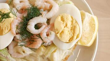 A Tasty and Delicious Shrimp Salad with Egg and a Lemon Garnish video