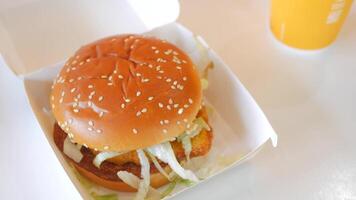 beef burger in a take away box on table video
