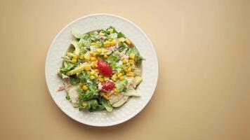 Fresh Salad with Corn and Juicy Tomatoes on a Beige Background video