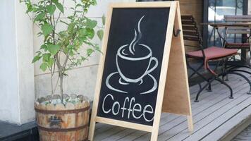 Chalkboard Coffee Sign Displayed at a Cozy and Inviting Cafe Setting video