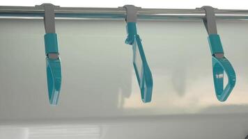 A row of yellow handle on a bus video