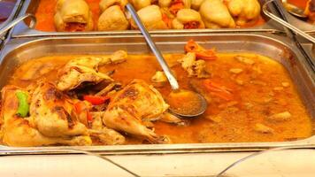 Indulge in a Delicious Chicken Curry in a Buffet Setting for All to Enjoy video