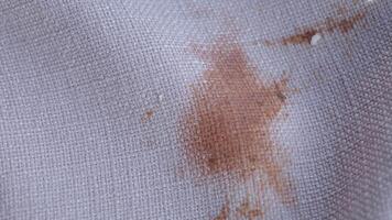Stained Fabric CloseUp Detailed View of Patterned Material Featuring an Orange Mark video