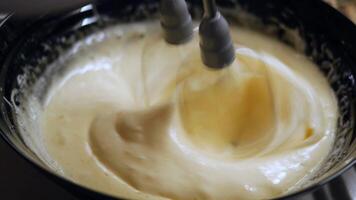 Whipping Cream Using an Electric Mixer in a Bowl for Various Recipes video