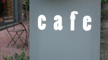 Charming Cafe Signage That Adds Character in an Urban Setting and Vibe video