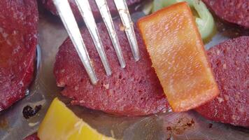 Cooked Sausages with Vegetables and Fork in Close-Up View video