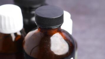 Close-Up of Brown and White Bottles with Caps on Display video