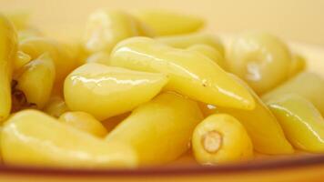 Top View of Pickled Vegetables in a Yellow Ceramic Bowl on Table video