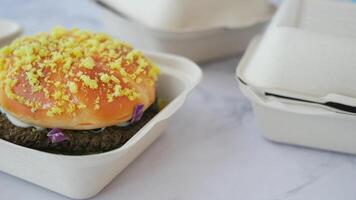 beef burger in a take away box on table video