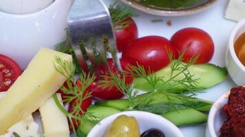 A colorful array of fresh vegetables and cheese on a platter video