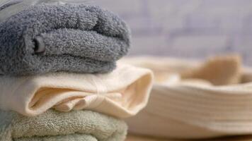 Neatly Stacked Soft Towels on Rustic Wood for Relaxation and Comfort video