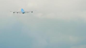 Four-engine double-deck cargo airliner high in the sky, rear view, long shot video