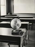 Grey Globe in a school classroom primary educate geography map on a desk photo