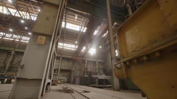 An industrial factory interior featuring natural light streaming in from various windows. Stock Clip video