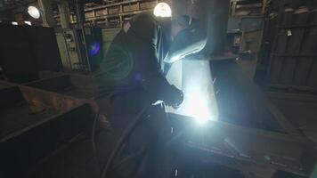 A Skilled Welder is Actively at Work in an Industrial Setting Focusing on Fabrication and Metalwork. Stock Clip video