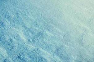 Fresh snow surface in sunny winter day. photo