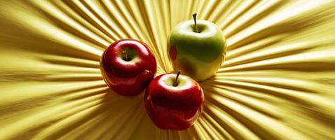 Fresh Red and Green Apples on Yellow Background. photo