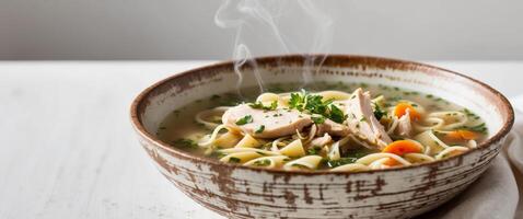 Close Up of Healthy Chicken Noodle Soup Comfort Food in Rustic Bowl Perfect for Cold Day. photo