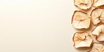 Few dried apple slices in a slightly curved line, culinary photography photo
