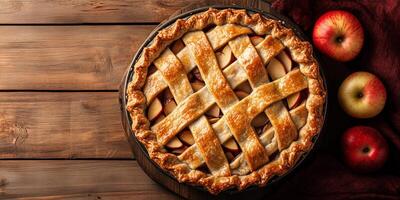 Freshly baked pie, with visible apple slices underneath a golden, crisscrossed top, food photography photo