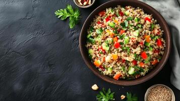 Quinoa salad in a shallow bowl with cooked quinoa, vegetables, herbs, and nuts arranged, culinary photography photo