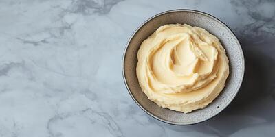 Serving of spread in a simple dish with no visible toppings or decorations, gastronomy photography photo