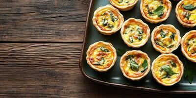 Mini quiches positioned evenly on a rectangular plate, photorealistic food photo