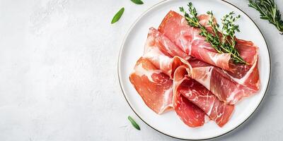 Prosciutto slices displayed on a white plate, with a sprig of fresh herbs, photorealistic food photo
