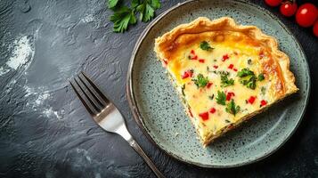 Quiche slice on a plate with a small bowl of garnish beside it, gastronomy photography photo