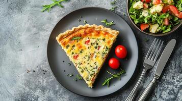 Quiche slice on a plate with a small bowl of garnish beside it, gastronomy photography photo