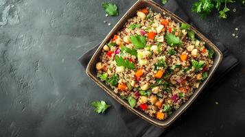 Quinoa salad in a square bowl with quinoa, chopped vegetables, herbs, and nuts arranged together, photorealistic food photo