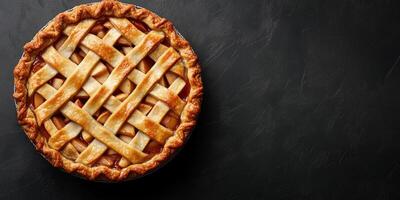 Freshly baked pie, with visible apple slices underneath a golden, crisscrossed top, food setting photo
