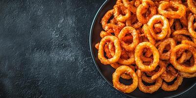 Pile of curly fries on serving tray, neatly arranged, meal photography photo