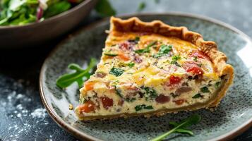 Close-up view of quiche slice on a plate, visible filling layers, and small salad bowl, meal photography photo