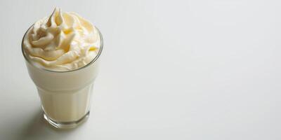 Glass of yogurt drink with a smooth, creamy texture, placed on a white background, culinary photography photo