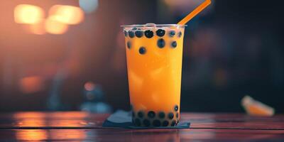 Cup of orange liquid with large black pearls at the base, with a straw inserted, photorealistic food photo