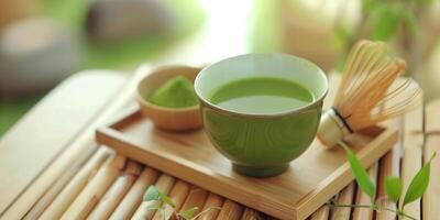 Cup of matcha tea with a whisk and bowl of matcha powder, photorealistic food photo