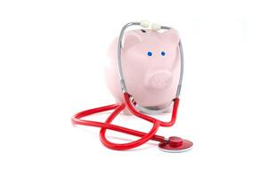 Piggy Bank With Stethoscope Symbolizing Financial Health and Savings photo