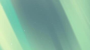 An animated image of a green aurora borealis video