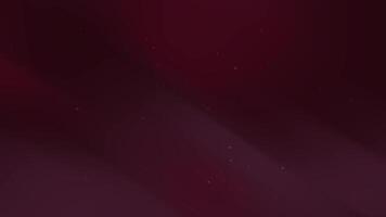 Dark red background has subtle light streaks and faint sparkles. video