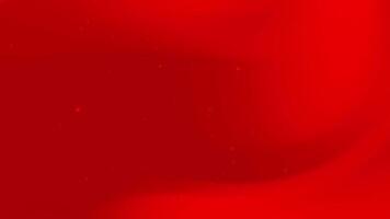 Red background features subtle texture and tiny light speckles. video