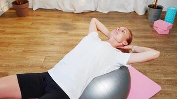 Woman Doing Core Exercises on Exercise Ball in Home video