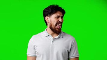 Man expresses strong emotion in front of bright green background during an engaging online presentation video